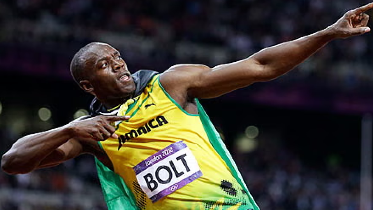 Usain Bolt in football gear running on a training pitch, preparing for a comeback with Wythenshawe Veterans
