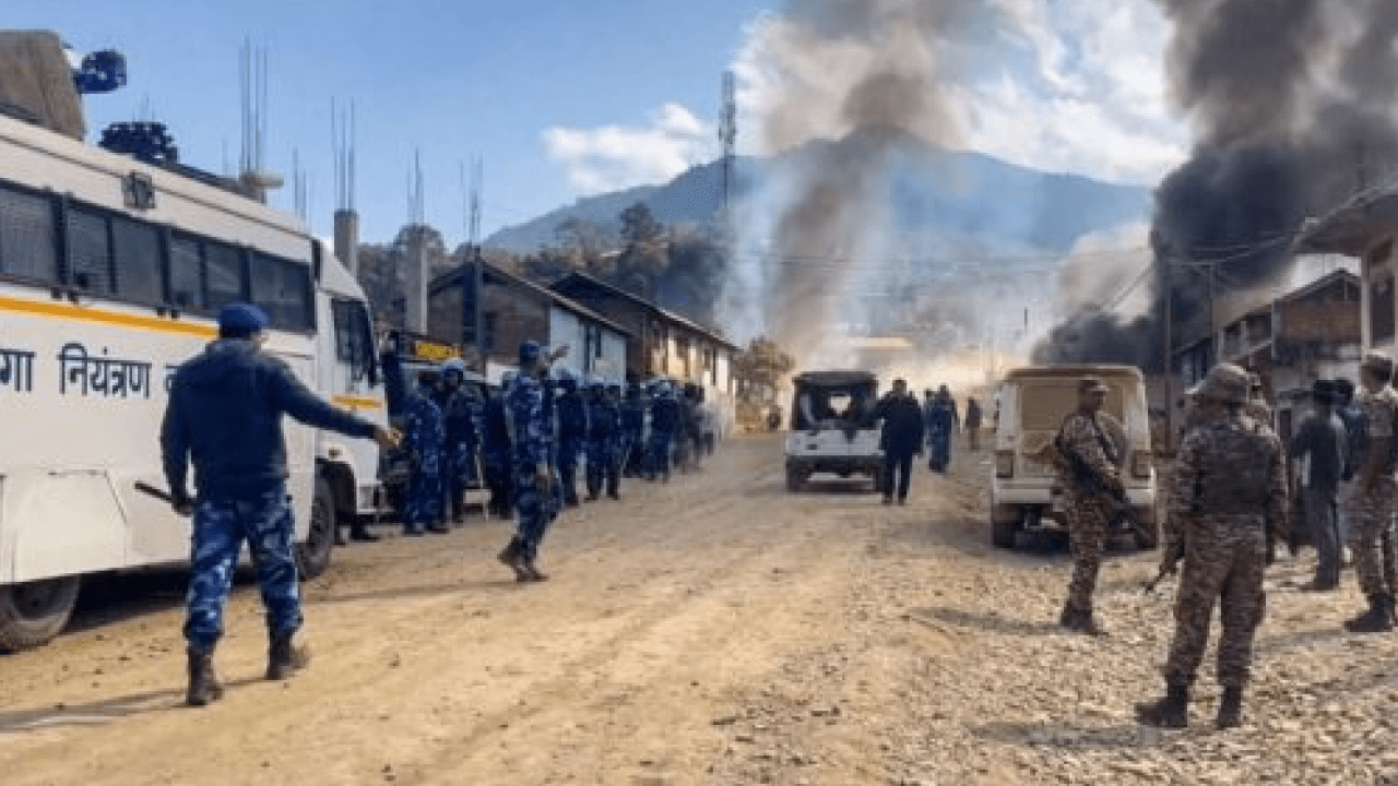 Police personnel escorting Kuki students during evacuation from Ukhrul district in Manipur amid Naga-Kuki clashes