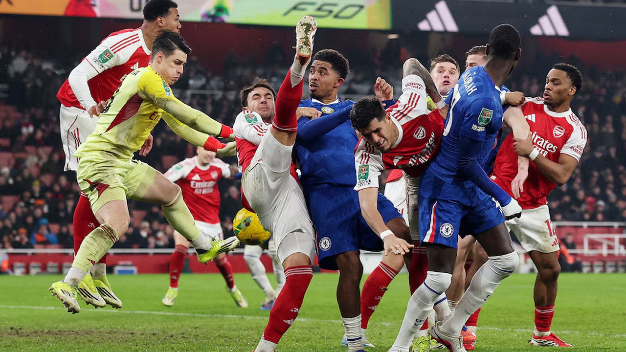 Arsenal players celebrate reaching the League Cup final after beating Chelsea at the Emirates Stadium