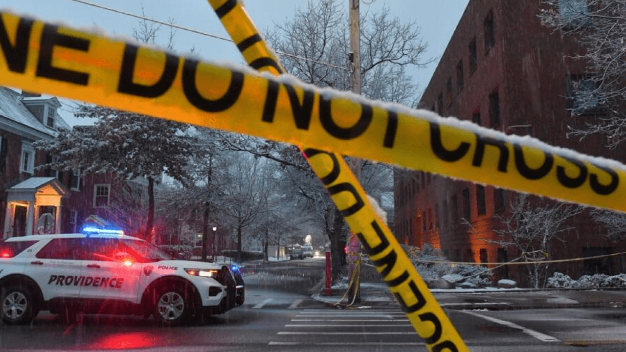 Police vehicles and emergency responders outside Tumbler Ridge Secondary School after deadly shooting in British Columbia