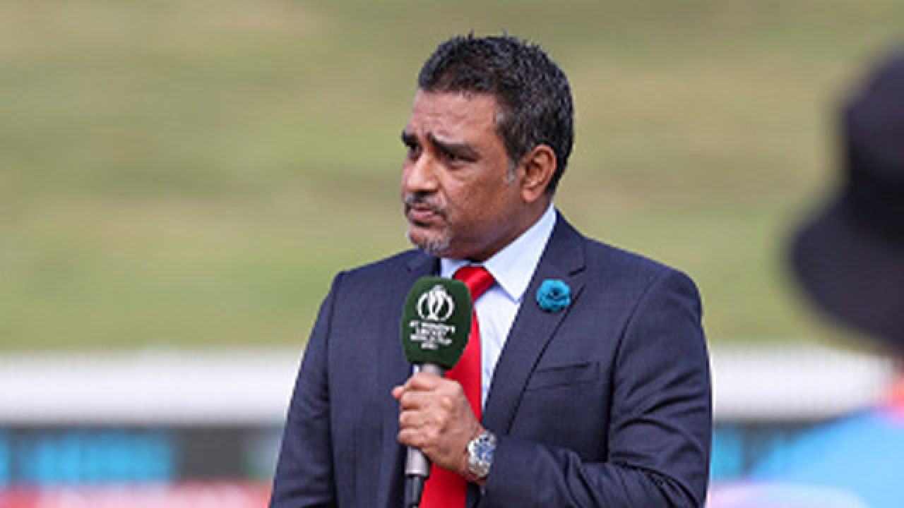 Sanjay Manjrekar speaking at a press event with T20 World Cup 2026 branding in the background