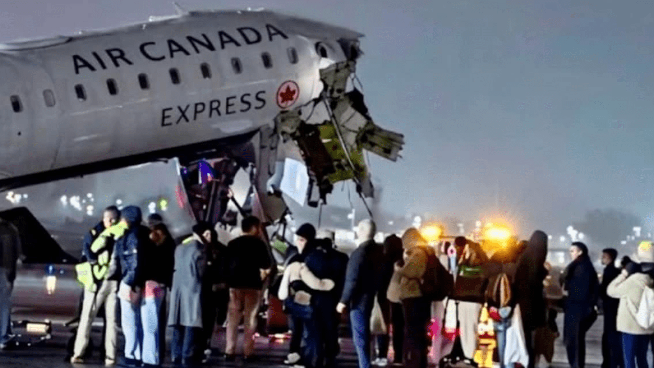 Damaged Air Canada Express CRJ-900 after collision with fire truck at LaGuardia runway