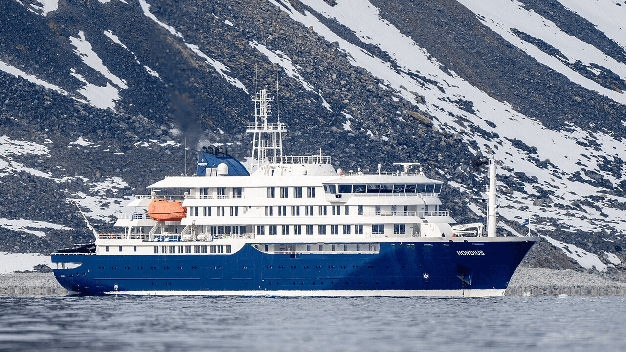MV Hondius cruise ship docked in Tenerife with medical personnel assisting passengers during hantavirus evacuation