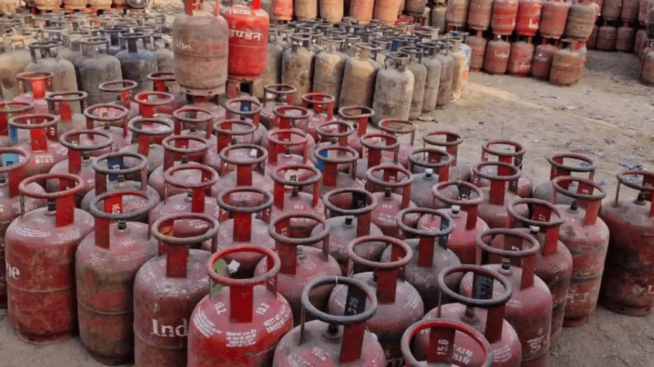 Commercial LPG cylinders stacked at a gas distribution facility as fuel prices rise across India amid global energy market volatility